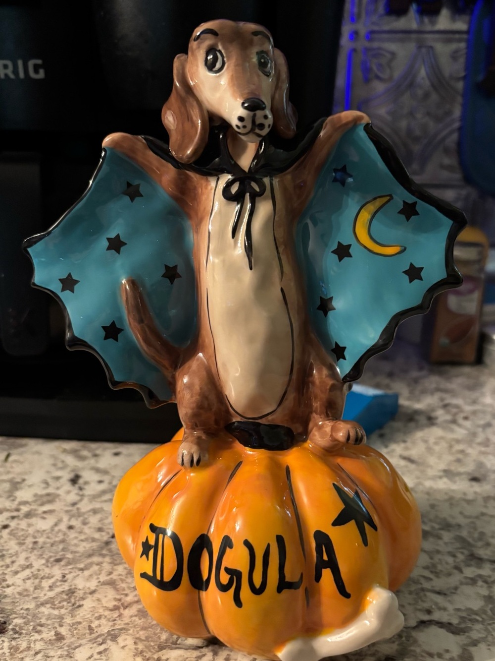 Blue Sky Brown Dachshund Dog Figurine with Teal Starry Cape on Orange Pumpkin